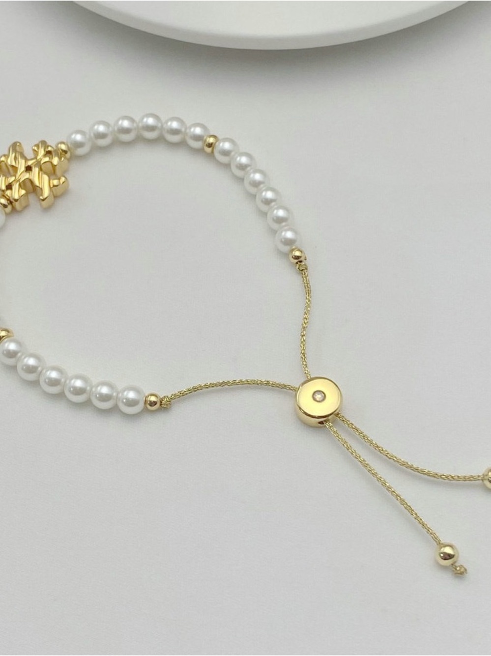 Tory Burch Gold and White Pearl Logo Adjustable Bracelet - Picture 5 of 5